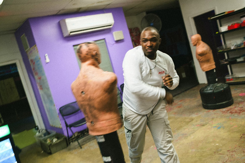 Ali smacking a practice dummy.